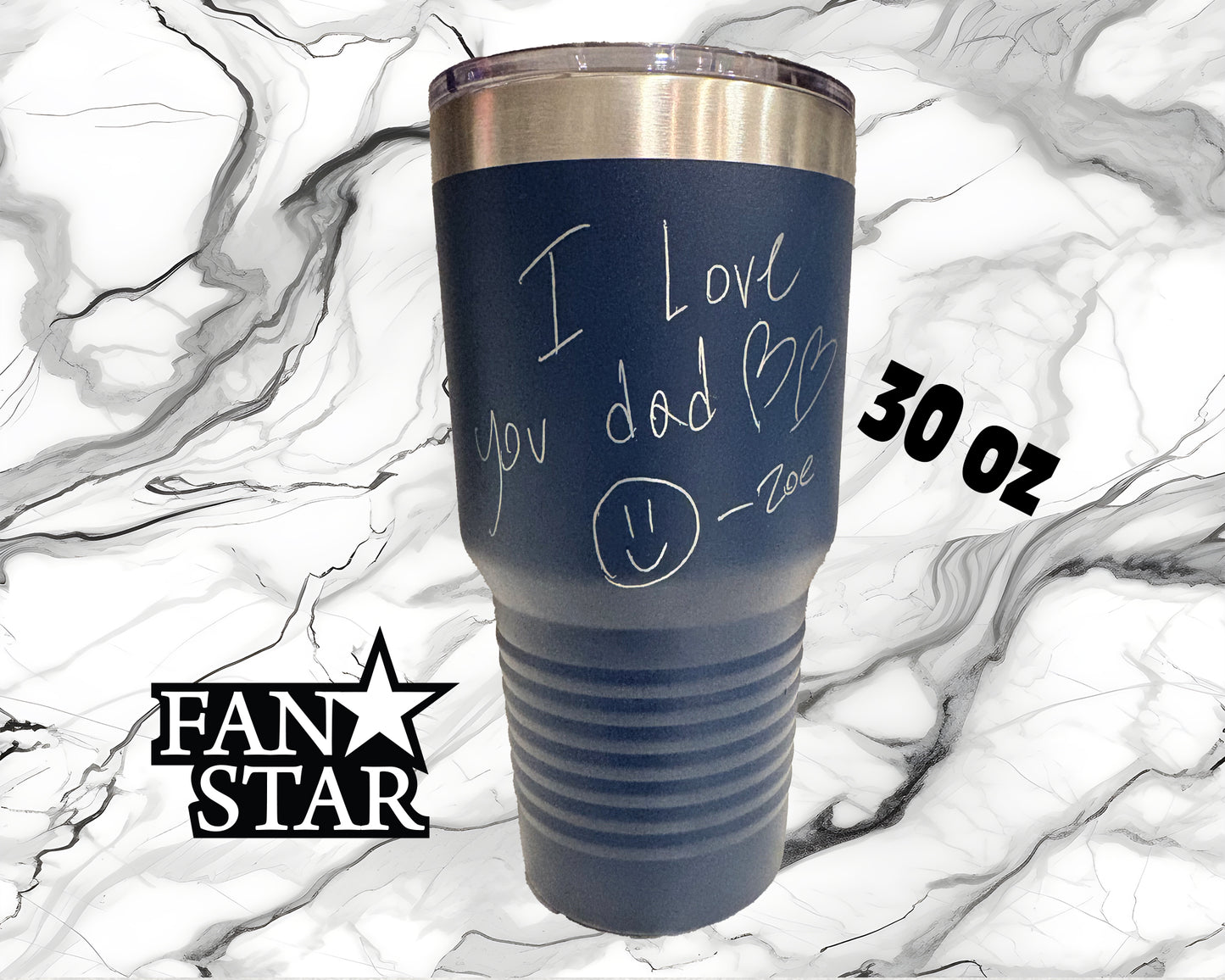 A blue tumbler with a handwritten message that says "I love you dad" and a smiley face drawn on it. The tumbler is placed on a marble background, and there is text indicating the size and weight of the item.
