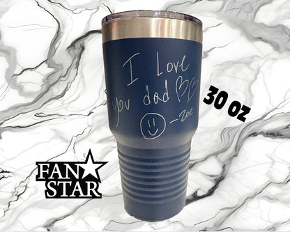 A blue tumbler with a handwritten message that says "I love you dad" and a smiley face drawn on it. The tumbler is placed on a marble background, and there is text indicating the size and weight of the item.